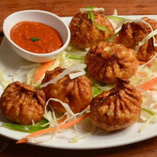 Veg  Momos {fried} (10 Pcs.) [Street and straw]